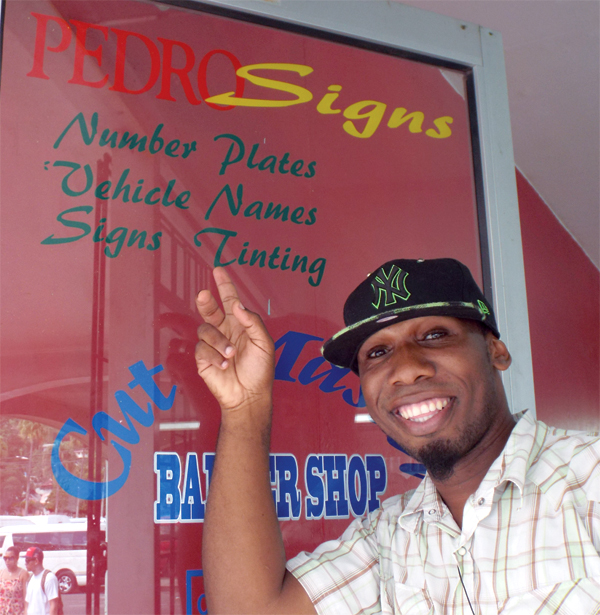 Pedro Julian outside his barbershop.