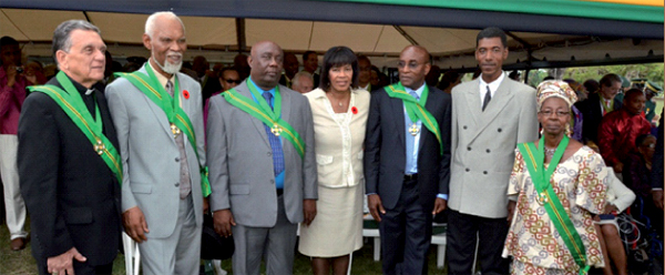 In photo are St. Lucian academics Professor Fitzroy Augier (2nd from left) and Professor Joseph Frederick (3rd from right) with the Prime Minister of Jamaica Hon. Portia Simpson-Miller (Centre) and other distinguished honourees.