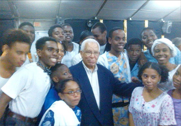 Image of Charles Cadet with cast of "The Legend of Tom Fool".