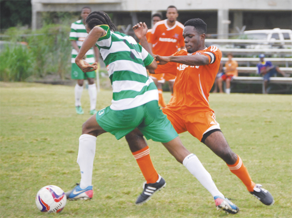 Tuff tassel for the ball between Northern United player Ameris Gilbert and VSC Captain Jonathan Symphorien. (PHOTO: Anthony De Beauville)
