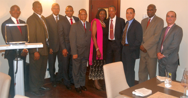 Minister Hippolyte with past and present officials of Invest St. Lucia.