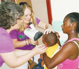 A young patient is being checked by Dr. Oakley.