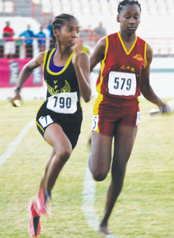 (L-R) Vieux Fort Comprehensive and Soufriere Comprehensive set the tone for the relay races. [Photo: Anthony De Beauville]
