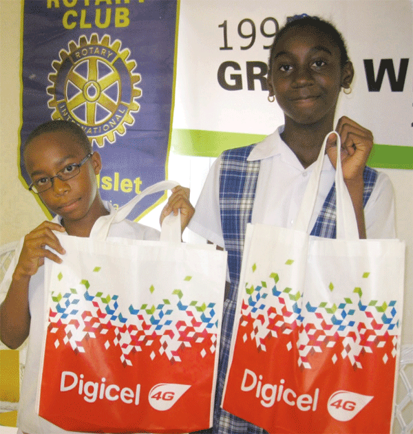 Nathan Sherman and Letana Bruneau of the Montessori Centre receive their prizes.