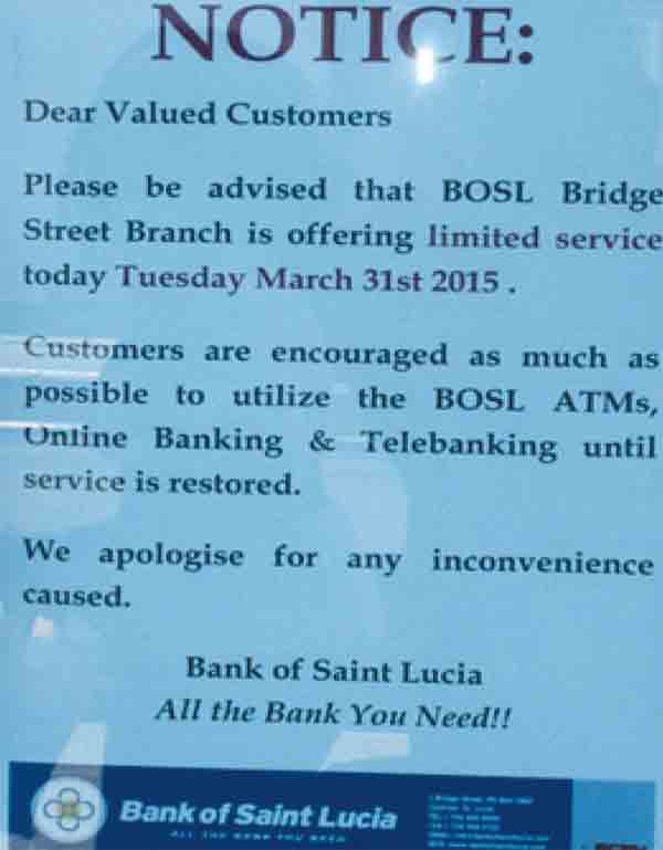 A notice posted on BOSL's Castries Waterfront branch which was closed last Tuesday. [Photo: Stan Bishop]