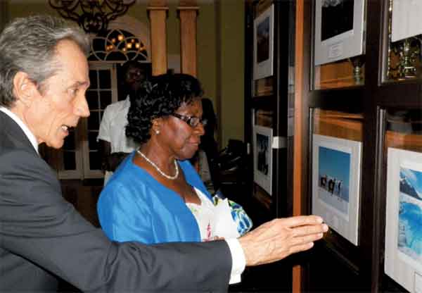In picture Ambassador Martinez discusses one of the photographs on display with Governor General Dame Pearlette Louisy