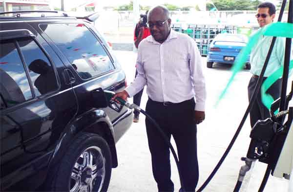 Everistus Jn Marie serves the first customer under the Rubis franchise.
