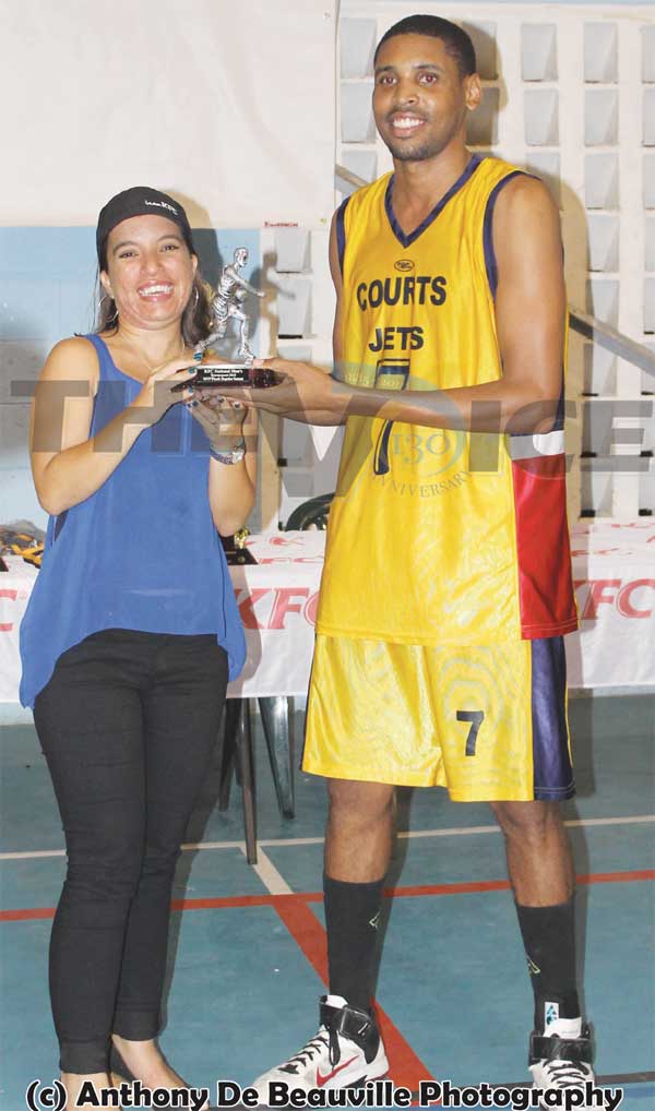 Image of MVP of the Final Keegan Preville receiving his award from KFC Marketing Officer Dionne Gardner. (Photo: Anthony De Beauville)