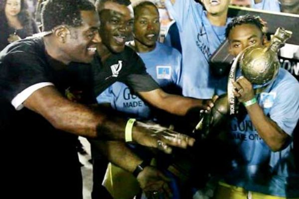 Image of an elated Veterans captain Romiel Felix with the Championship trophy.