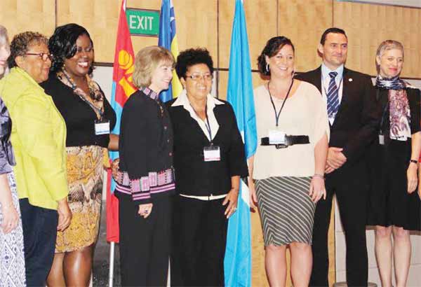 In photo fifth and sixth from left Ms.EyontheHusbands andMs. Crystal Showers with members of WCPT in Singapore.