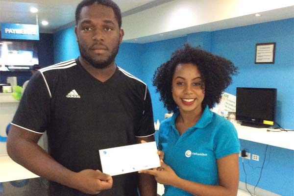 Image: Bishamber receives his cheque from Flows BibiannaMangal. Below is Lance Mathurin.
