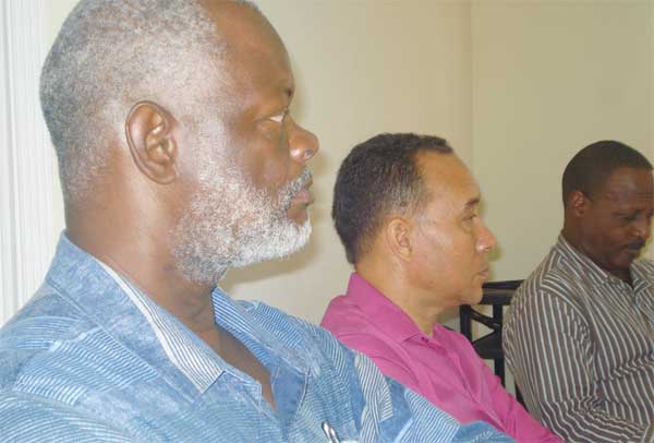 Commission members John Peters, Gordon Charles and BrianLouisy.