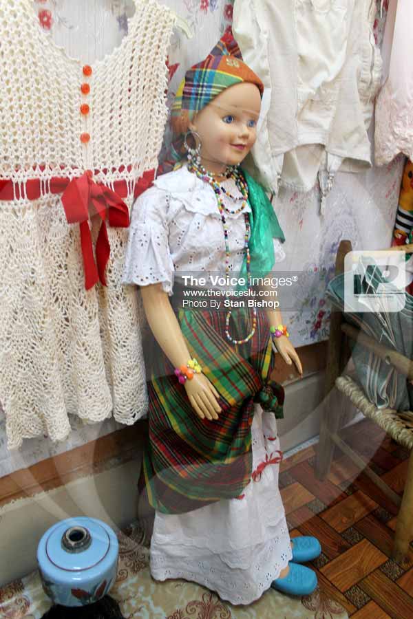 Image: A doll dressed up in Creole attire. [PHOTO: Stan Bishop]