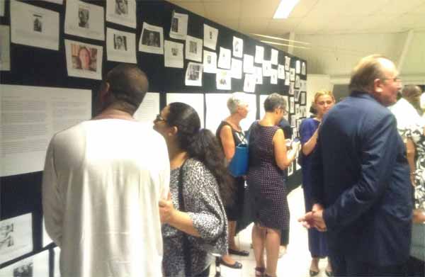 Image: Viewing pictures of victims of the attack.