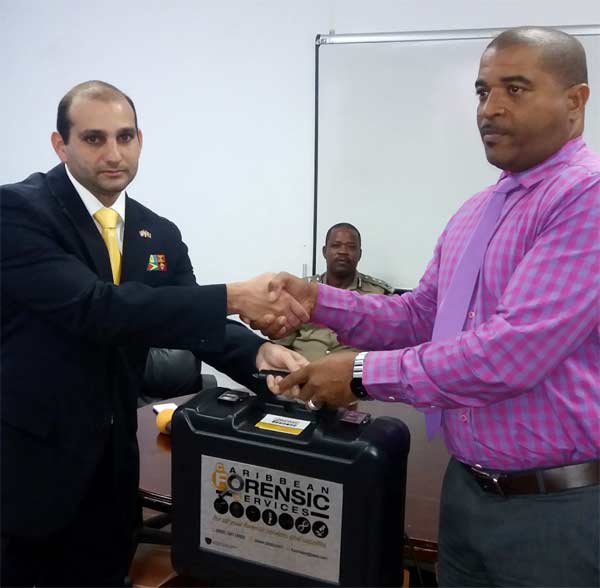 Image: Aboud presents the forensic kit.