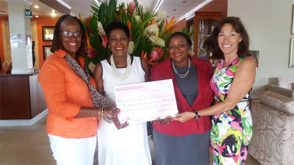 Catherine Sealys (second from right) is presented with a $10,400 cheque from “100 Women who Care”