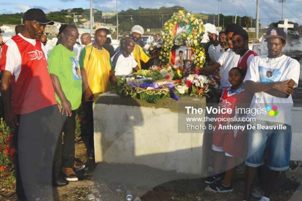 Image: Members of the Congorians football team say their final goodbye. (Photo Anthony De Beauville)