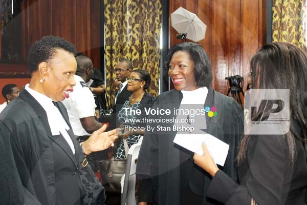Image: Victoria Charles-Clarke being greeted by President of the Saint Lucia Bar Association, Mary Juliana Charles. (Photo by Stan Bishop)