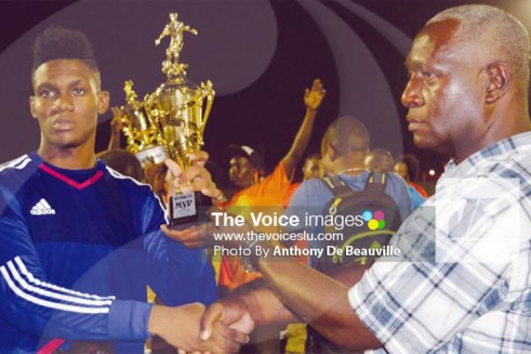 Image: Micoud 2 custodian Noah Didier receiving the MVP from SLFA representative Emmanuel Belasse. (PHOTO: Anthony De Beauville)