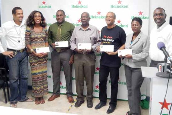 Image: Representatives of the various group organizing Jazz events were on hand to receive their sponsorship cheques from Heineken. Left to right are: Thomas Leonce, Sales & Marketing Manager WLBL, Candy Nicholas of Soufriere Jazz, Louis Lewis, Director of SLTB, Gus Small of Different Shades, Peter St. Rose of Salsa Saint Lucia, Lydia d’Auvergne of HTS/Jazz on the Square and Gaius Harry, Heineken Brand Manager.