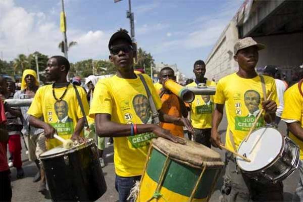 Image: Supporters of presidential candidate Jude Celestin from the LAPEH political party, play the drums during campaign rally in Port-au-Prince, Haiti last October.