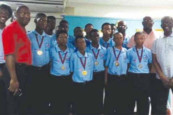 Image: A proud moment for the 2016 Windwards Under-15 Champion Cricket Team along with government officials on Sunday. (PHOTO: AC