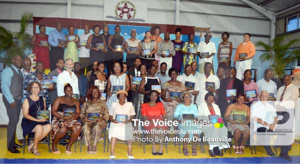 Awardees take time out for a group photo with Gros Islet MP Emma Hippolyte. [PHOTO: Anthony De Beauville]