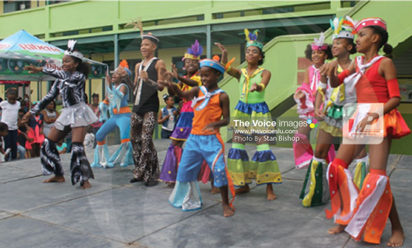 img:Young revellers bounce to Ezra’s catchy groovy soca, “Swim My Way”. [PHOTO: Stan Bishop}