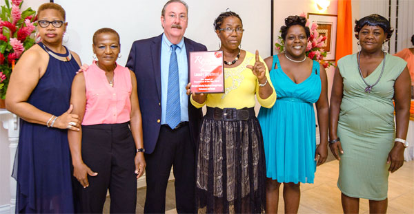 Image: Laundry Manager and staff with GM.