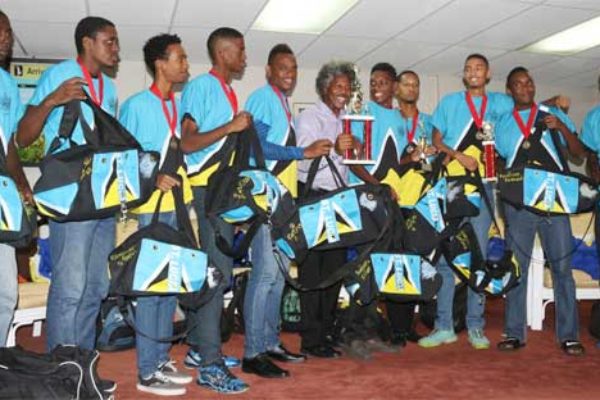 Image: Picture moment for Team St. Lucia and PS Youth Development and Sports Dr. Anthony George at the George F.L. Charles Airport VIP Lounge..