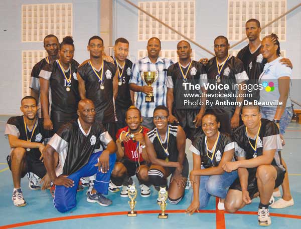 Image: A photo moment for the 2016 champions along with Acting Police Commissioner Severin Moncherry holding Championship trophy (Photo: Anthony De Beauville)