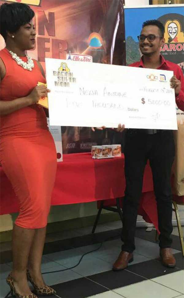 Image: Antoine picks up her $5,000 cheque.