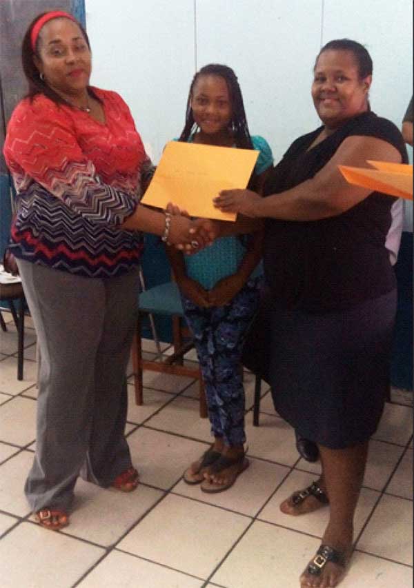 Image: Some parents receive scholarship documents.