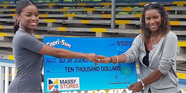 (L-R) Massy Stores representative presenting Sea Jays Sue Monplaisir with  sponsorship cheque  (PHOTO: SJSC)  