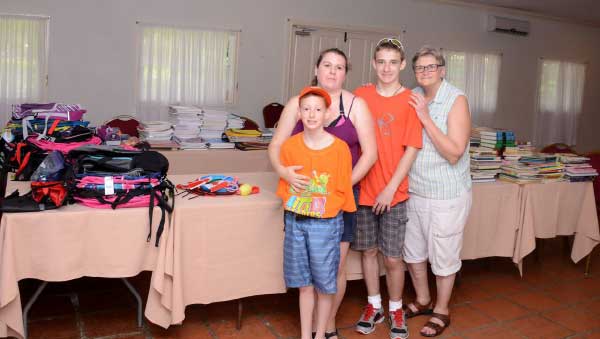 Image: Noah and his family before repacking boxes for school.