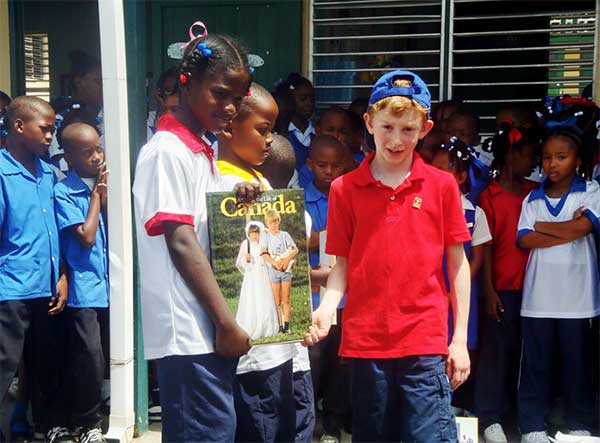 Image: Noah makes a symbolic presentation at a school.