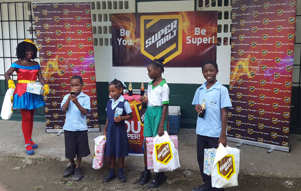 img; Four students from La Croix Maingot Combined receive early Christmas gifts from SuperMalt.