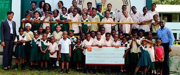 Image: Students, staff, principal of the Des Barras School with CIBC/FCIB Country Manager.