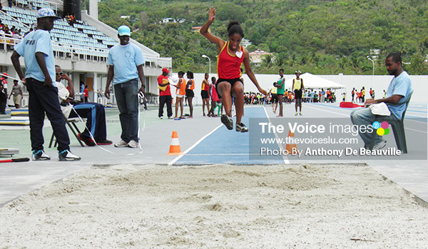 Image: Field event officials keeping a close eye in the ladies’ long jump. (Photo: Anthony De Beauville)