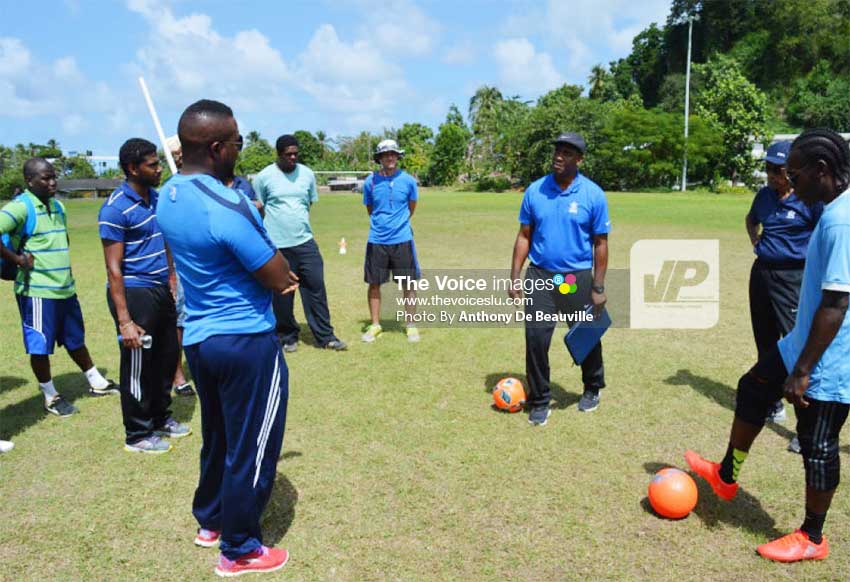 Image: (L-R) Local coaches listening attentively during a practical session