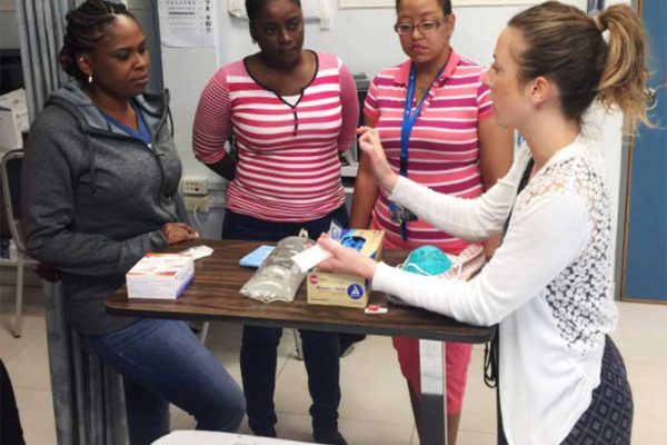 Image: Nurse Educator, Christina Emanuele, from the SickKids Centre for Global Child Health (right) engaging some of the regional nurses during one of the practical sessions.