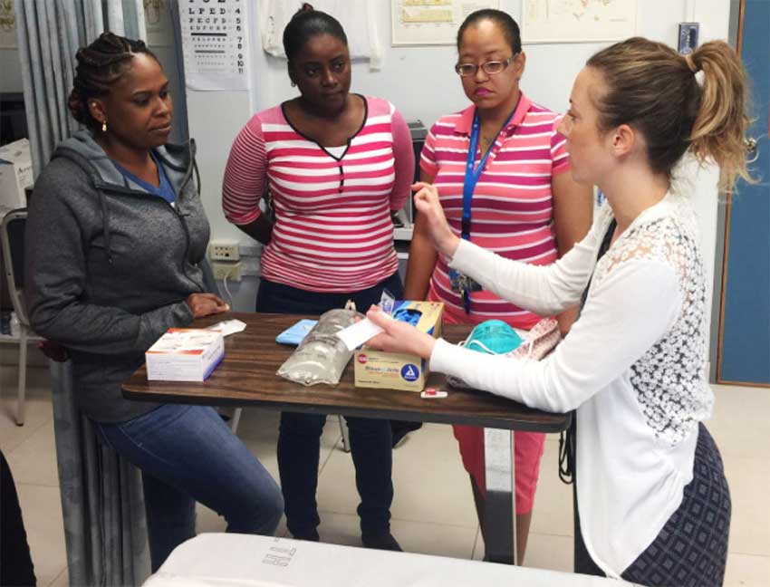Image: Nurse Educator, Christina Emanuele, from the SickKids Centre for Global Child Health (right) engaging some of the regional nurses during one of the practical sessions.