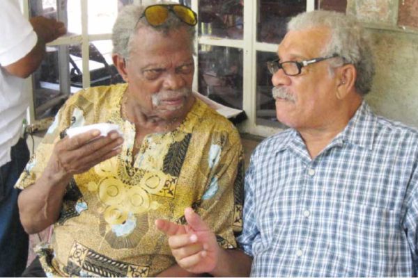 Image of Dunstan St. Omer and Derek Walcott at the launch of the Harold Simmons Folk Academy in October 2012.