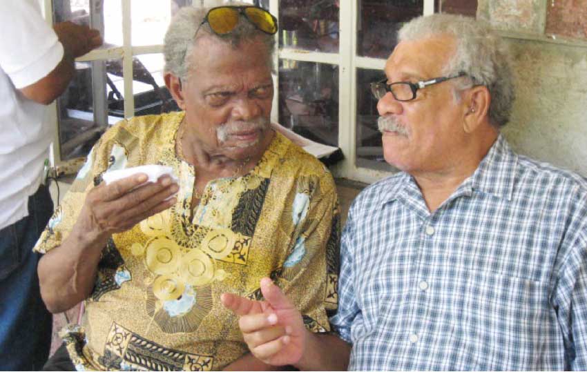 Image of Dunstan St. Omer and Derek Walcott at the launch of the Harold Simmons Folk Academy in October 2012.