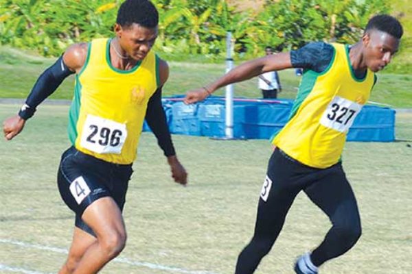 Image: (Left) Choiseul Secondary Jeanmeachel Etienne and Kenneth Verneuil in epic finish in the boys under 18 - 200 metres final; (right) Kimani Alphone of Vieux Fort Comprehensive wins the girls under 18 - 200 metres finals. (PHOTO: Anthony De Beauville)