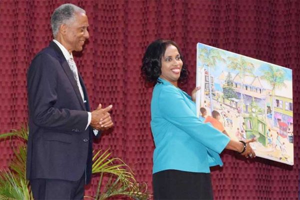 Image: Justice Saunders receives a gift from the Government of St. Kitts.