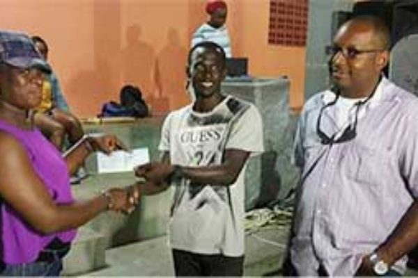 Image: VFS Football League 1st Vice President JeffaBelasse receiving sponsorship cheque for the Tournament from a representative of O.B. Sadoo Engineering, while Managing Director Bradly Sadoo(Photo: VFSFL)