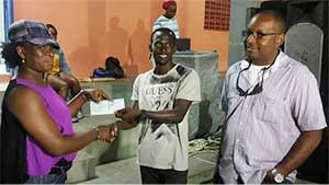 Image: VFS Football League 1st Vice President JeffaBelasse receiving sponsorship cheque for the Tournament from a representative of O.B. Sadoo Engineering, while Managing Director Bradly Sadoo(Photo: VFSFL)