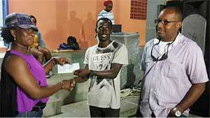 Image: VFS Football League 1st Vice President  JeffaBelasse receiving sponsorship cheque for the Tournament from a representative of   O.B. Sadoo Engineering, while Managing Director Bradly Sadoo(Photo: VFSFL)