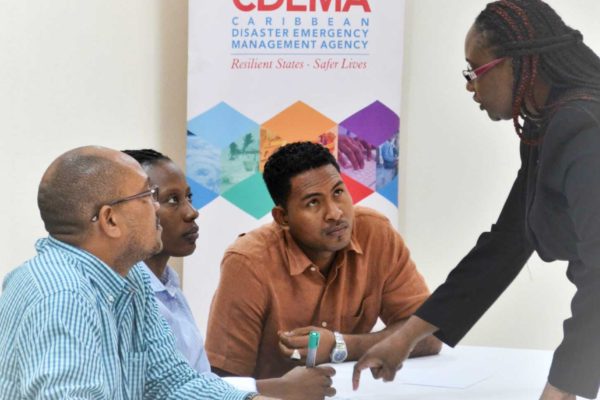 Image: Members of the ODM Dominica Staff during an orientation session at the CDEMA Coordinating Unit. L-R: Fitzroy Pascal, National Disaster Coordinator (Ag.), Karen ReviereCuffy, Programme Officer and Donalson Frederick, Programme Officer with Andria Grosvenor, Planning and Business Development Manager, CDEMA.